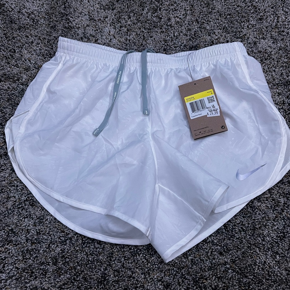Nike White Athletic Shorts with Curved Hem and Elastic Waistband